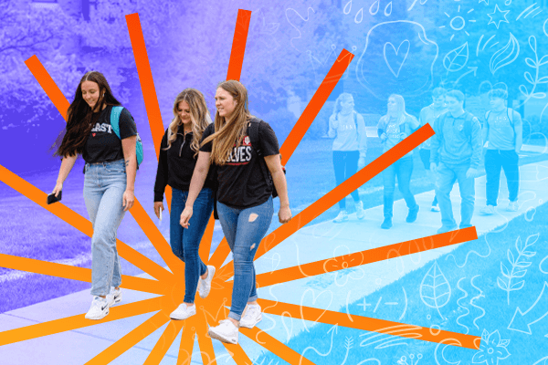 Three young women walking on the IU East campus