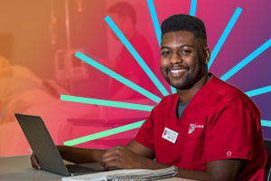 An IU East medical student at his computer