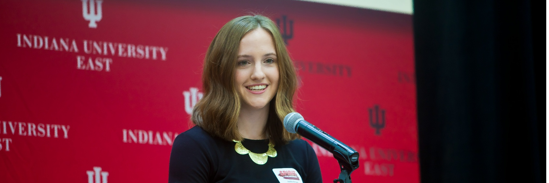 IU East student Addie Brown speaking at an event.