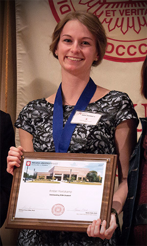 Amber Huelskamp receiving award for Outstanding Bachelor of Science in Nursing student.
