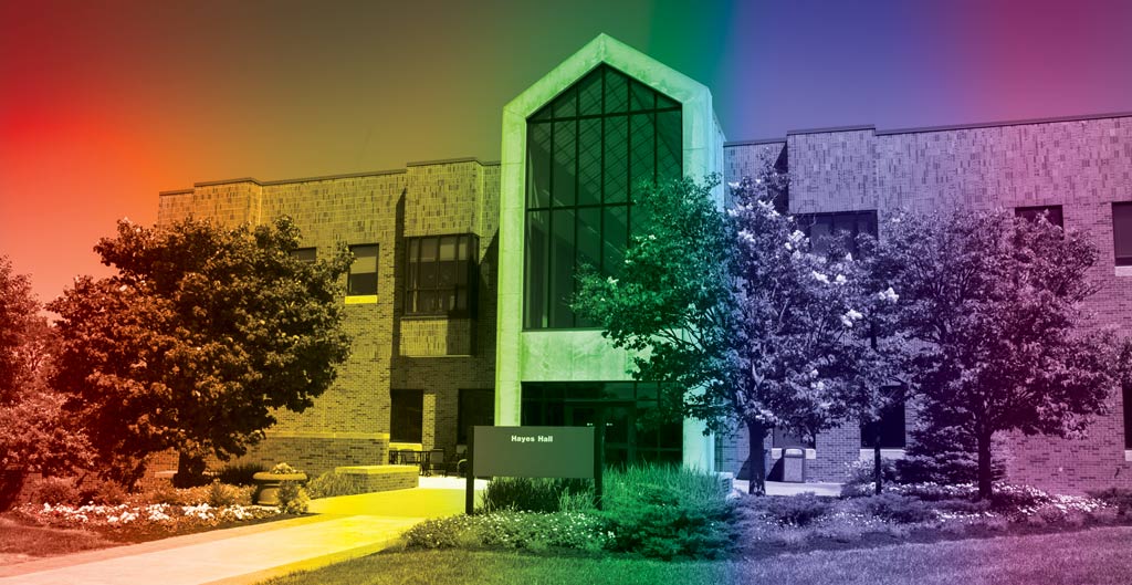 Rainbow pride colors overlaying photo of Hayes Hall.