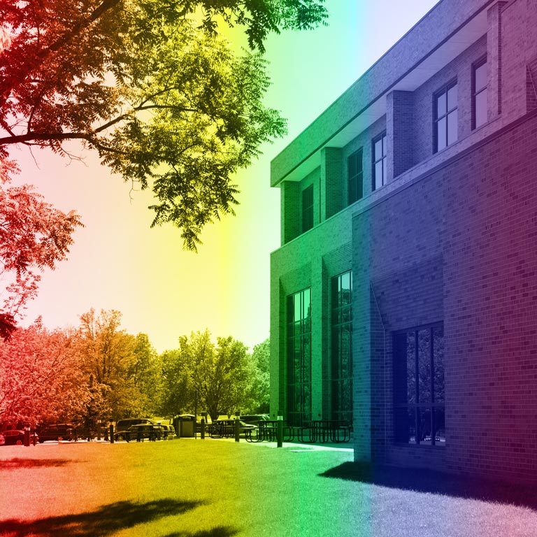 Rainbow pride colors overlaying photo of Tom Raper Hall.