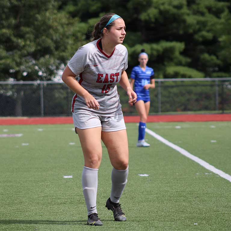 IU East women's soccer athlete trying to intercept the soccer ball during a match.