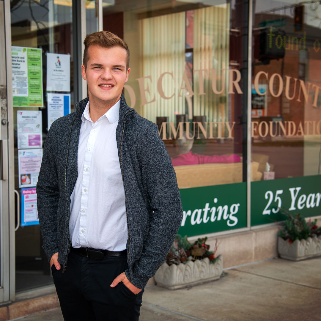Alex Sefton smiling while standing in front of the Decatur County Community Foundation.
