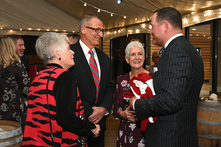 Chancellor Kathy Girten and her husband Gary socializing.