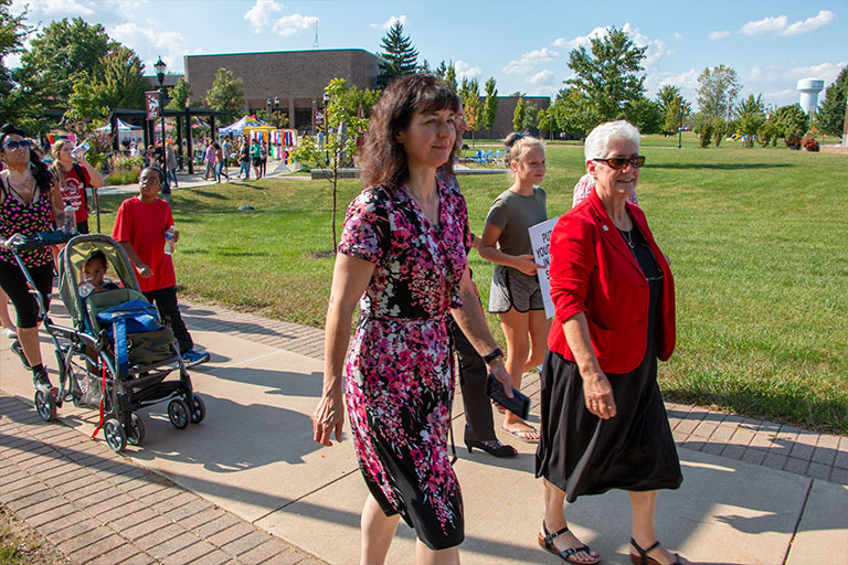 Chancellor Girten and Vice Chancellor of Academic Affairs Malott participating in the Walk a Mile in Her Shoes event.