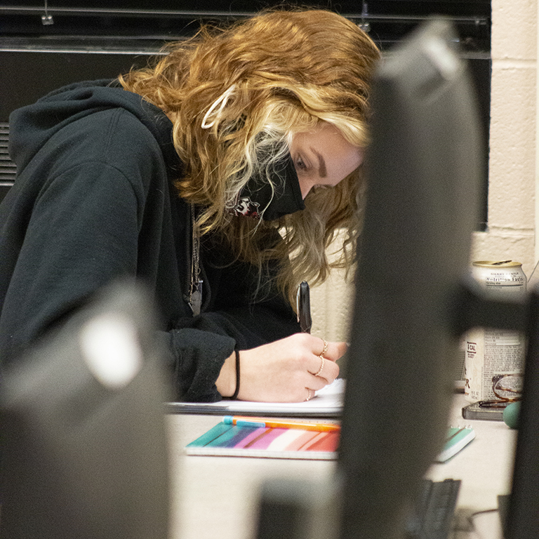 Delaney Hayes, a criminal justice major, prepares before class with Assistant Professor of English Kelly Blewett. She and her classmates are in the last week of classes and final exams at IU East.